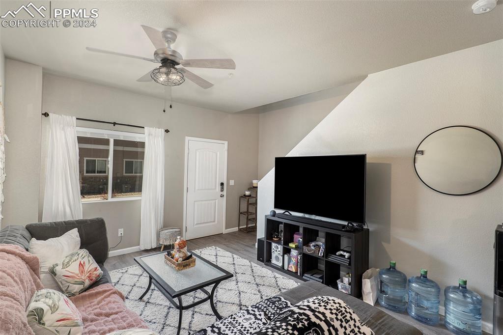 4346 Yellow Dock Point Colorado Springs, CO 80911 - Photo 4 of 20 a living room with furniture and a flat screen tv