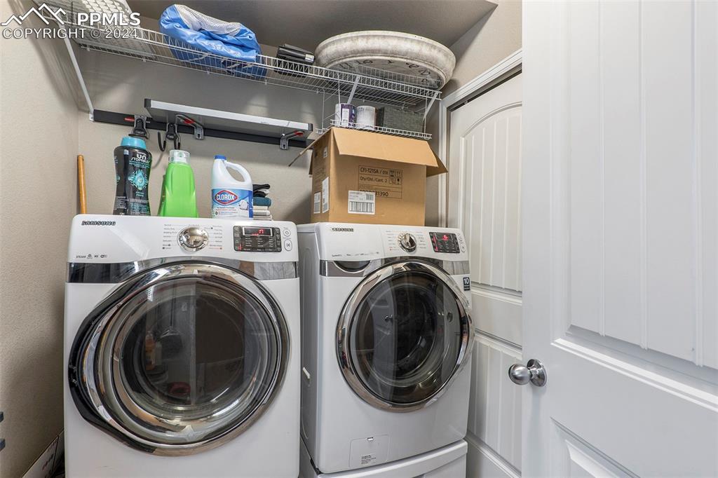 4346 Yellow Dock Point Colorado Springs, CO 80911 - Photo 8 of 20 a utility room with dryer and washer
