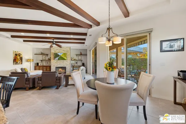 a kitchen with a stove fireplace and a table