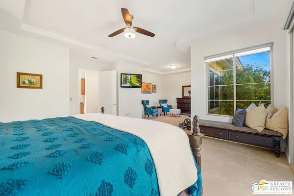 a bedroom with a bed and furniture