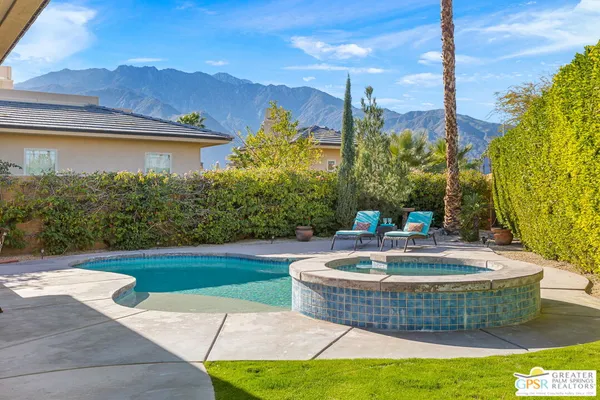 a patio with a yard table and chairs