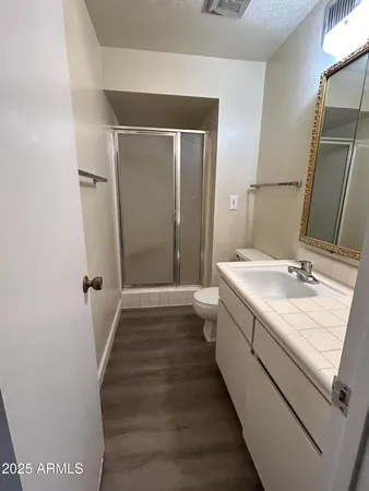 a bathroom with a sink and mirror
