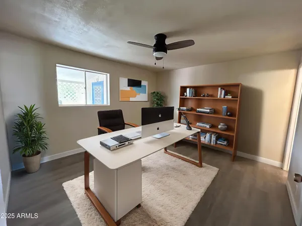 a workspace with furniture and a window