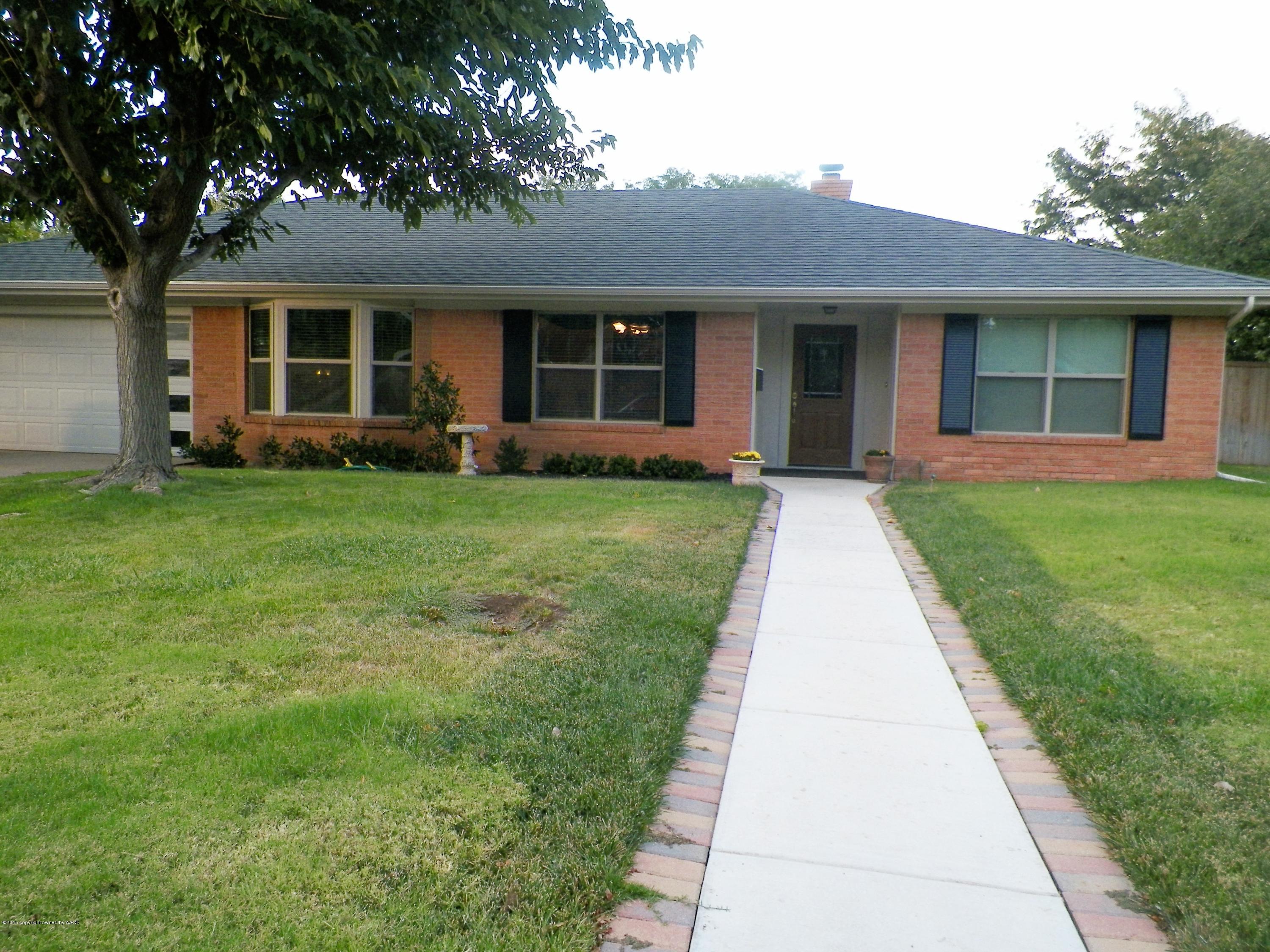7100 Jameson Road Amarillo, TX 79106 - Photo 1 of 6 front view of a house with a yard