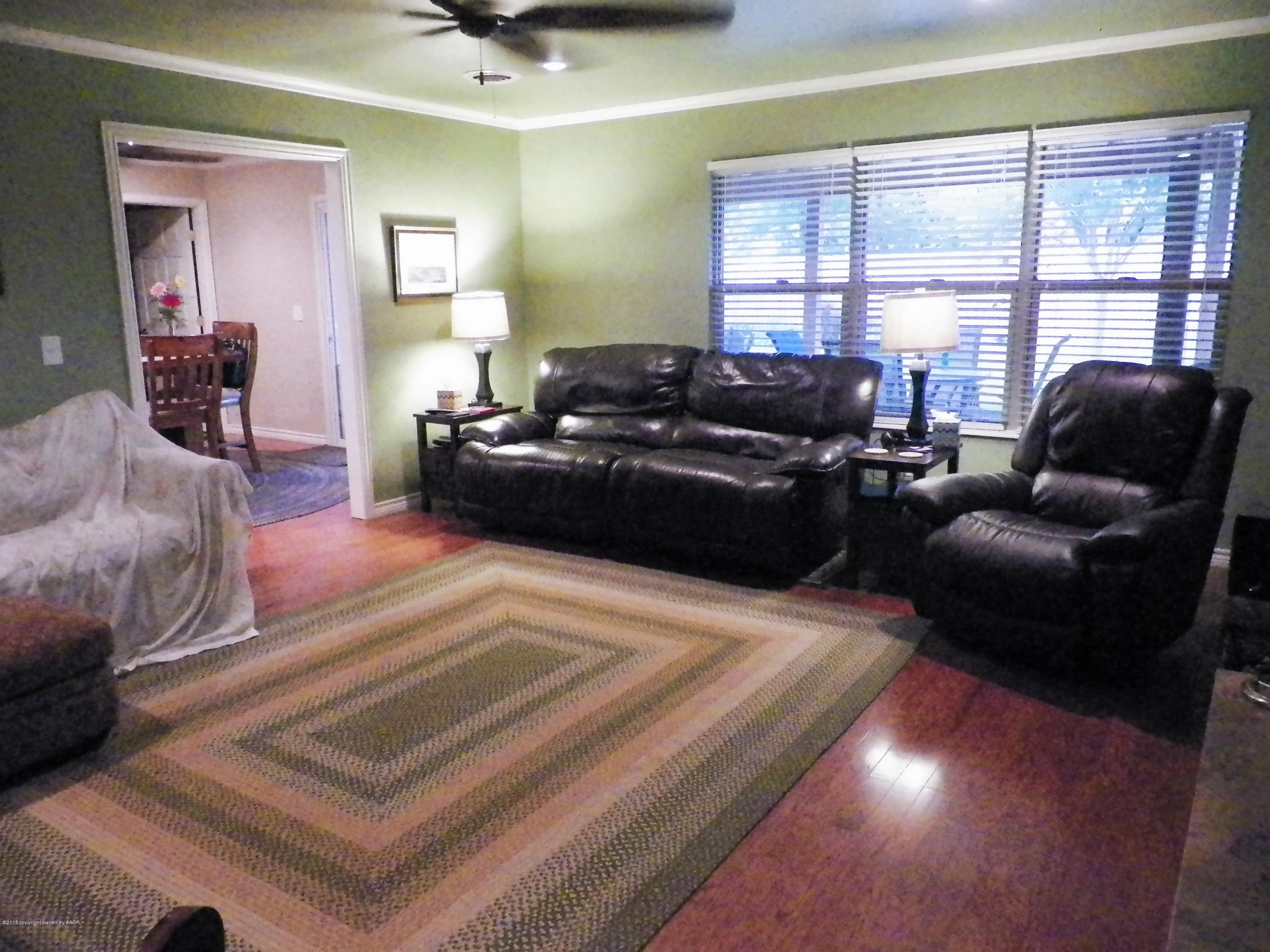 7100 Jameson Road Amarillo, TX 79106 - Photo 4 of 6 a living room with furniture and a large window
