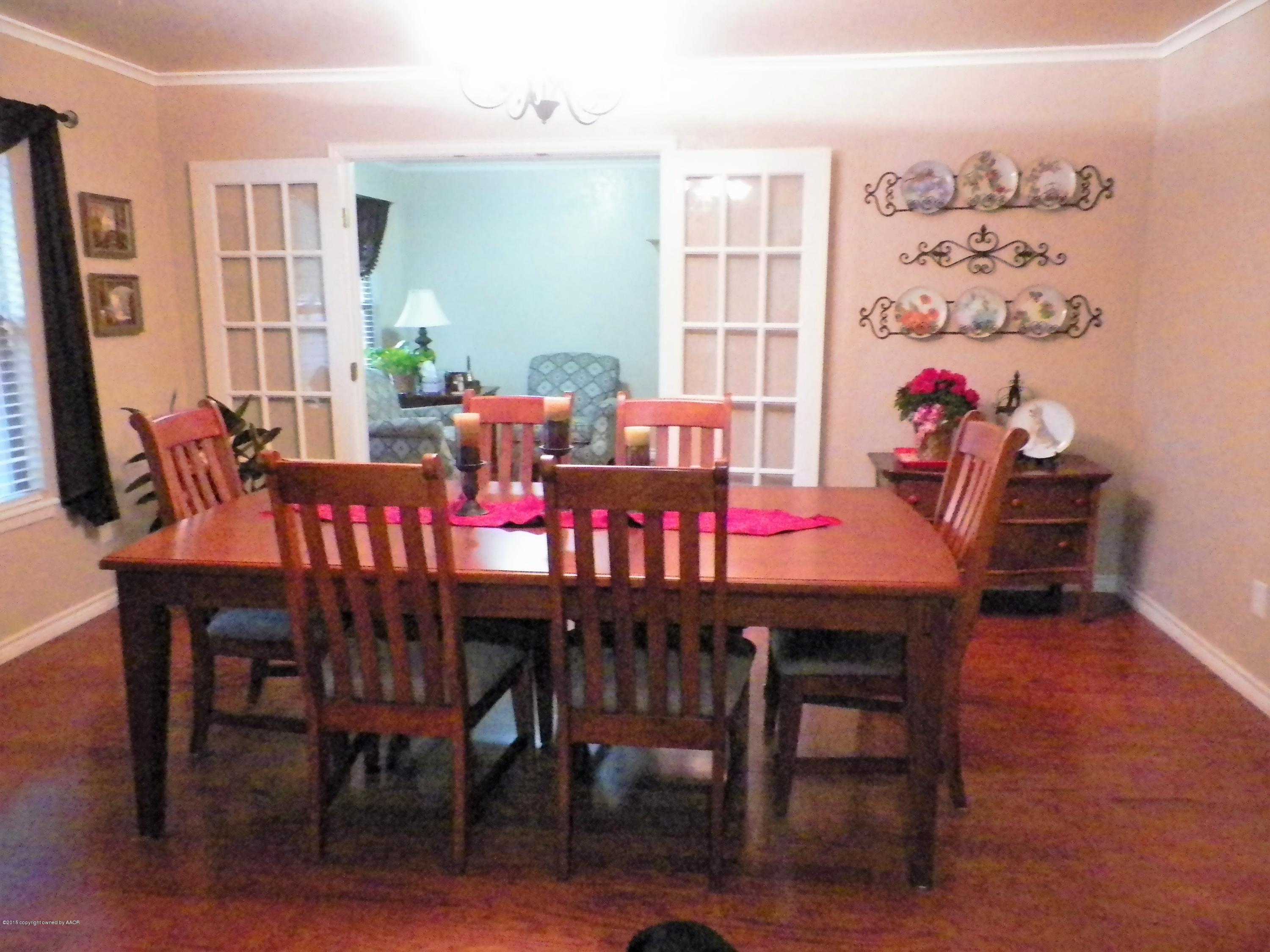 7100 Jameson Road Amarillo, TX 79106 - Photo 6 of 6 a view of a dining room with furniture and window