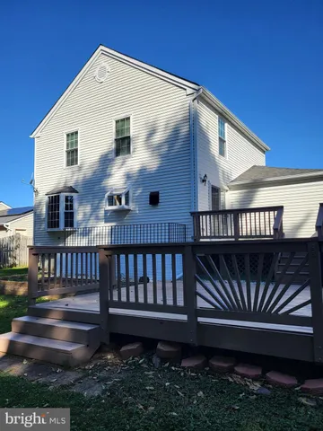 a view of a house with wooden deck