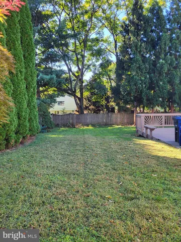 a view of a wooden deck and a yard