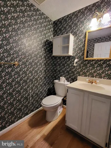 a bathroom with a toilet and a sink