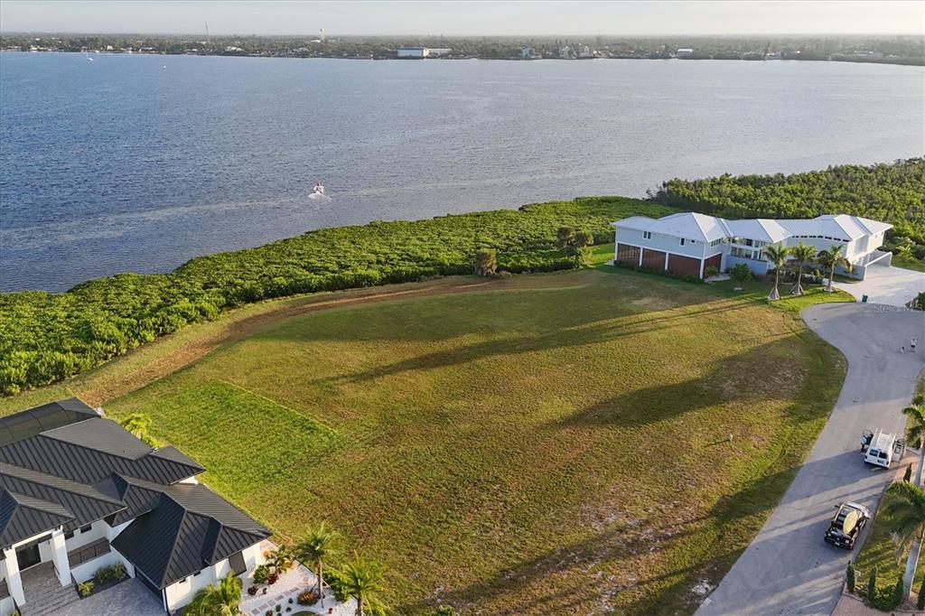 5248 The Pointe Englewood, FL 34223 - Photo 14 of 20 a view of a lake with a big yard