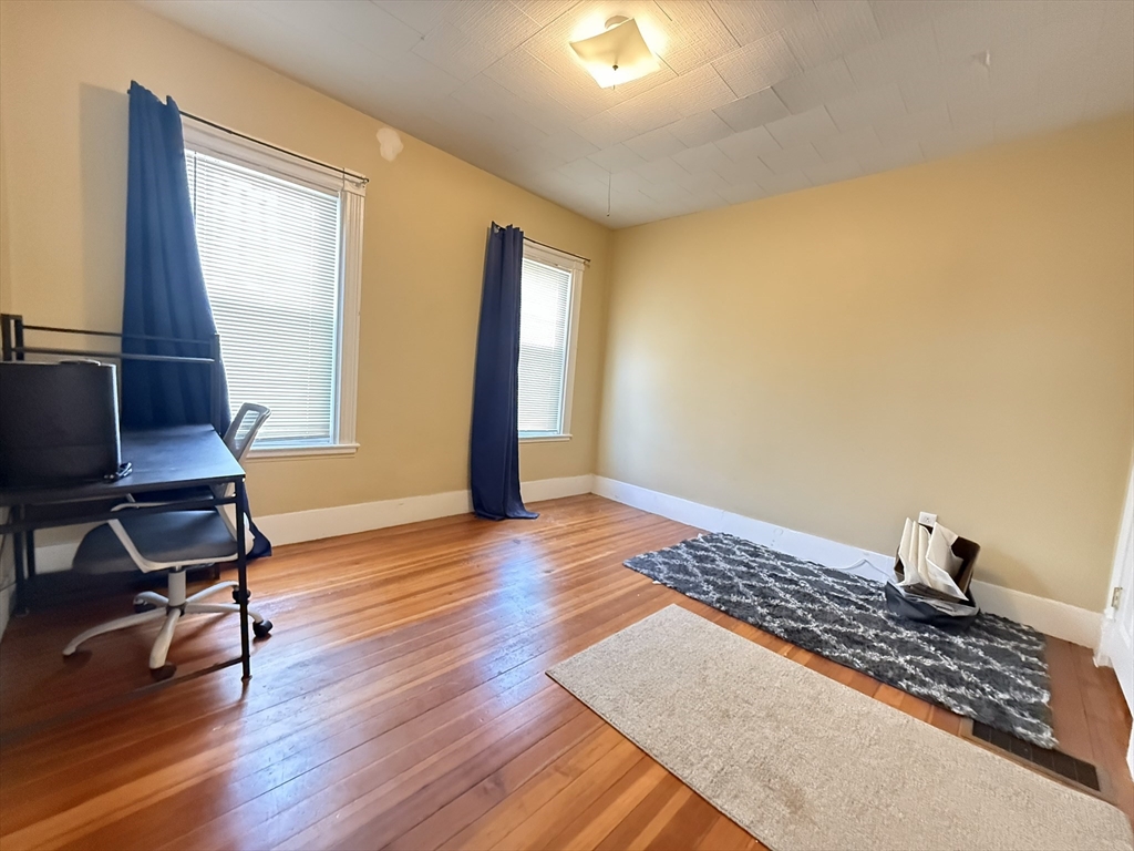 53 Litchfield Street, Unit 53 Boston, MA 02135 - Photo 5 of 14 a view of workspace with wooden floor and window
