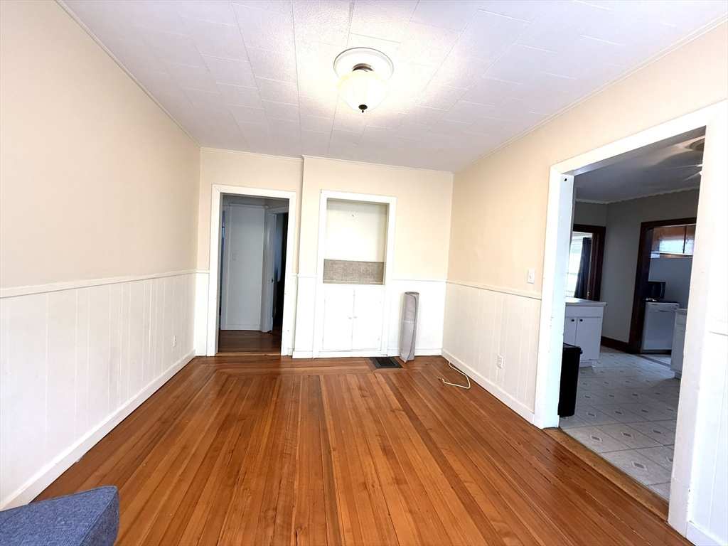 53 Litchfield Street, Unit 53 Boston, MA 02135 - Photo 6 of 14 a view of a livingroom with wooden floor