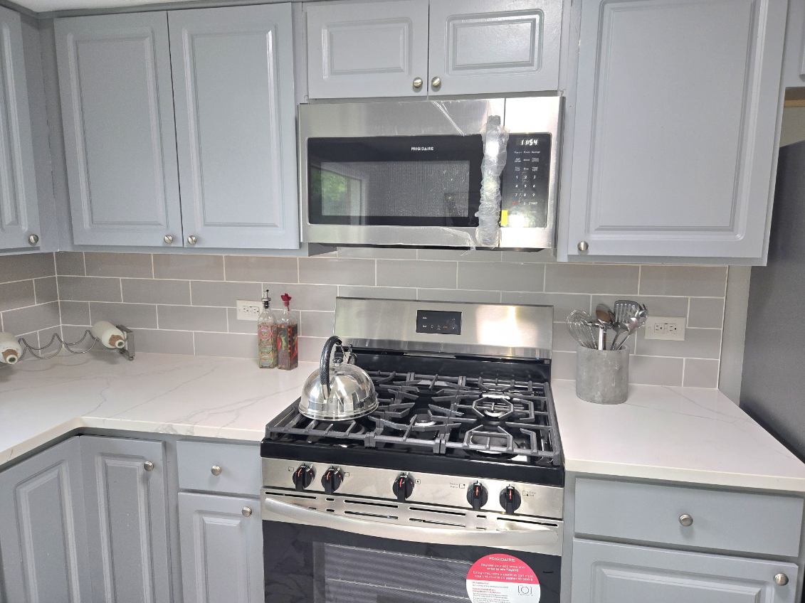 926 Braemar Road Flossmoor, IL 60422 - Photo 15 of 35 a kitchen with stainless steel appliances granite countertop a stove and a sink