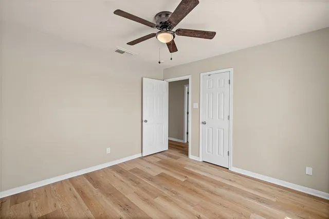 a bathroom with a double vanity sink and mirror