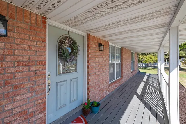 a view of a balcony with chairs