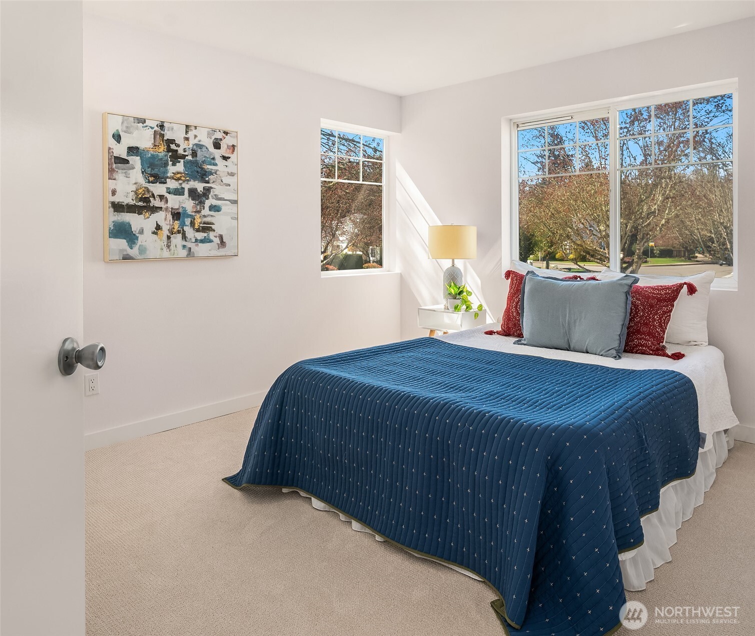 5505 South 236th Place Kent, WA 98032 - Photo 15 of 24 a bedroom with a large bed and a window