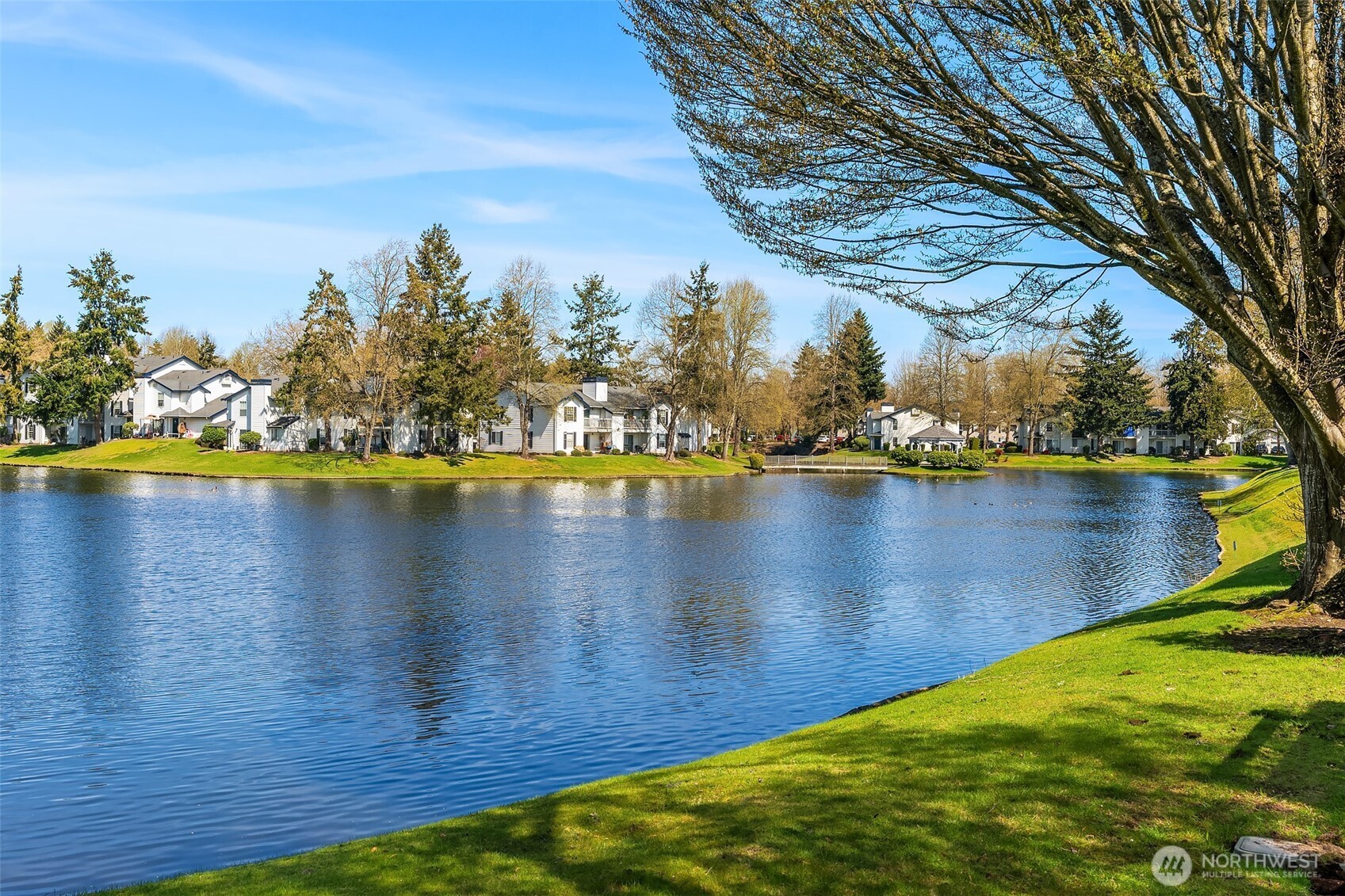 5505 South 236th Place Kent, WA 98032 - Photo 22 of 24 a view of a lake with houses in the back