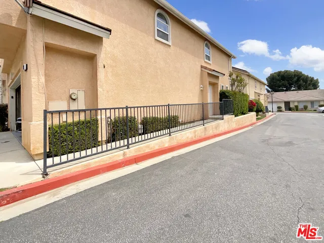 a view of a house with a street