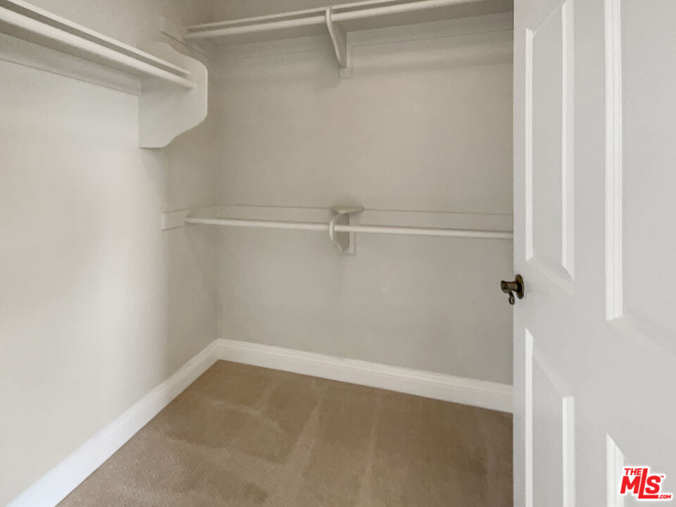 15232 Foothill Boulevard, Unit 111 Sylmar, CA 91342 - Photo 18 of 19 a view of a room with racks on the wall