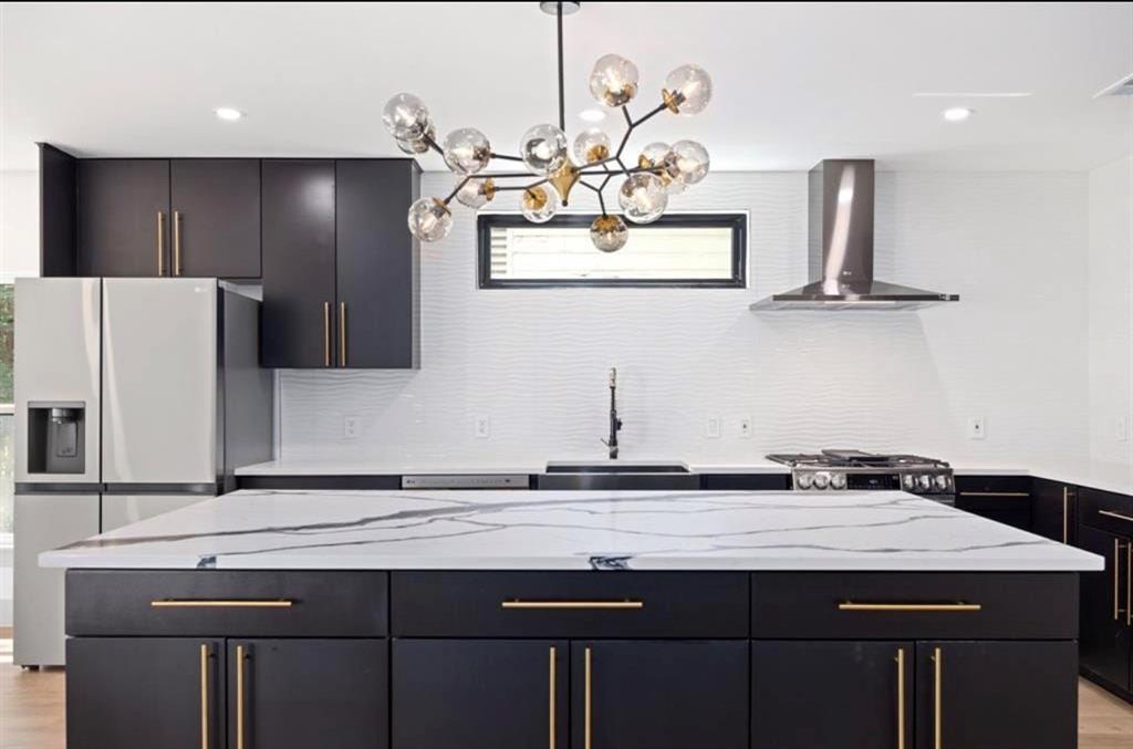 4927 Linnet Lane Dallas, TX 75209 - Photo 5 of 17 a kitchen with a sink cabinets and stainless steel appliances