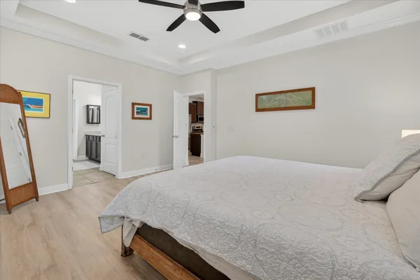 a bedroom with a bed and a dresser