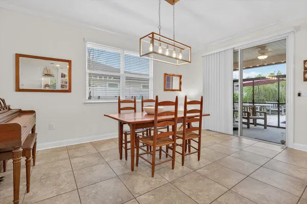 a dining room with furniture and wooden floor