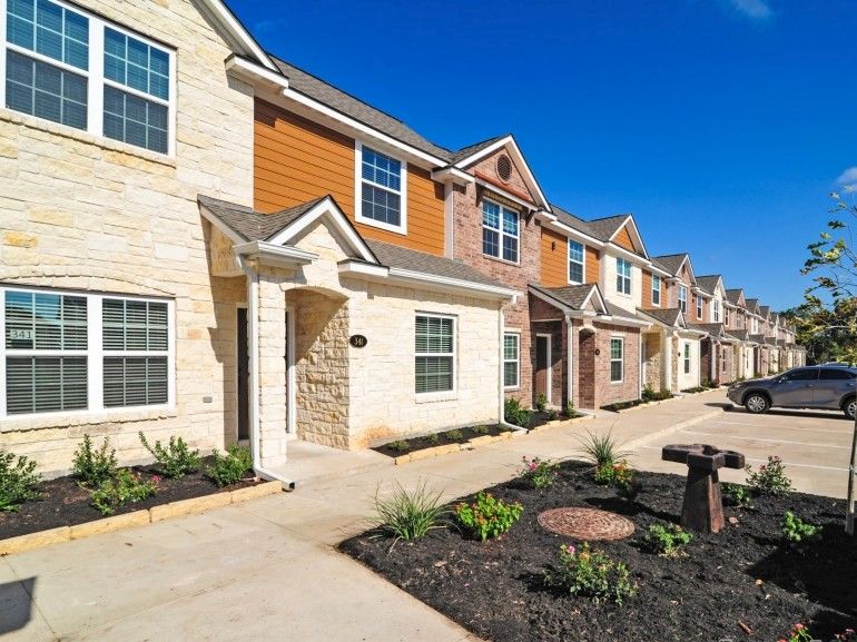 301 Southwest Parkway, Unit 314 College Station, TX 77840 - Photo 1 of 14 a front view of a house with garden