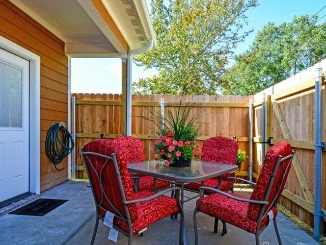 a outdoor dining space with furniture and outdoor view