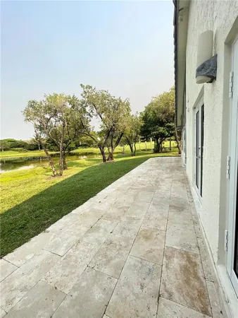 a view of house with yard