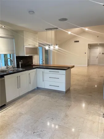 a view of a kitchen with a sink