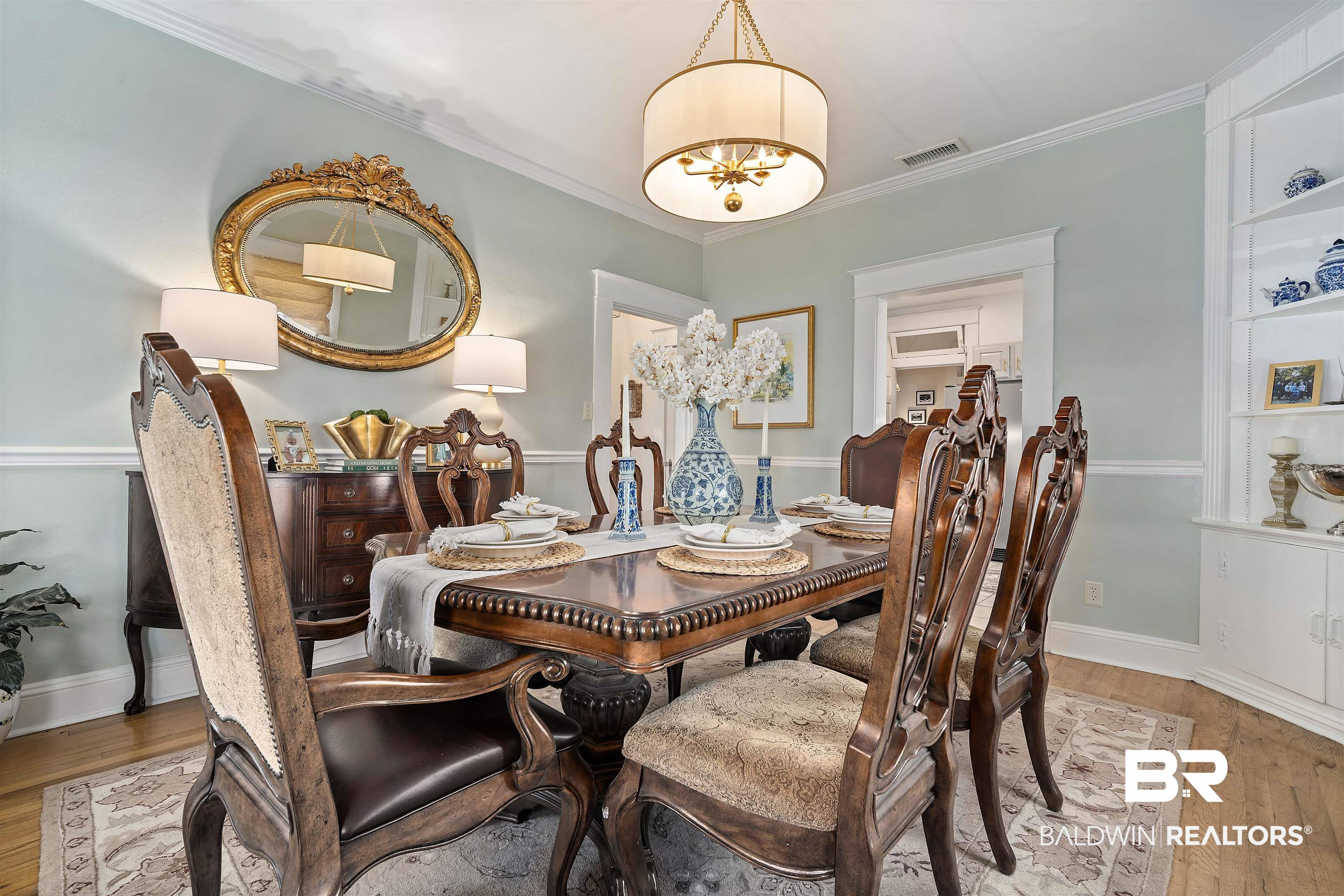 168 Mohawk Street Mobile, AL 36606 - Photo 14 of 31 Dining room featuring light wood-style flooring, crown molding, and hanging lights