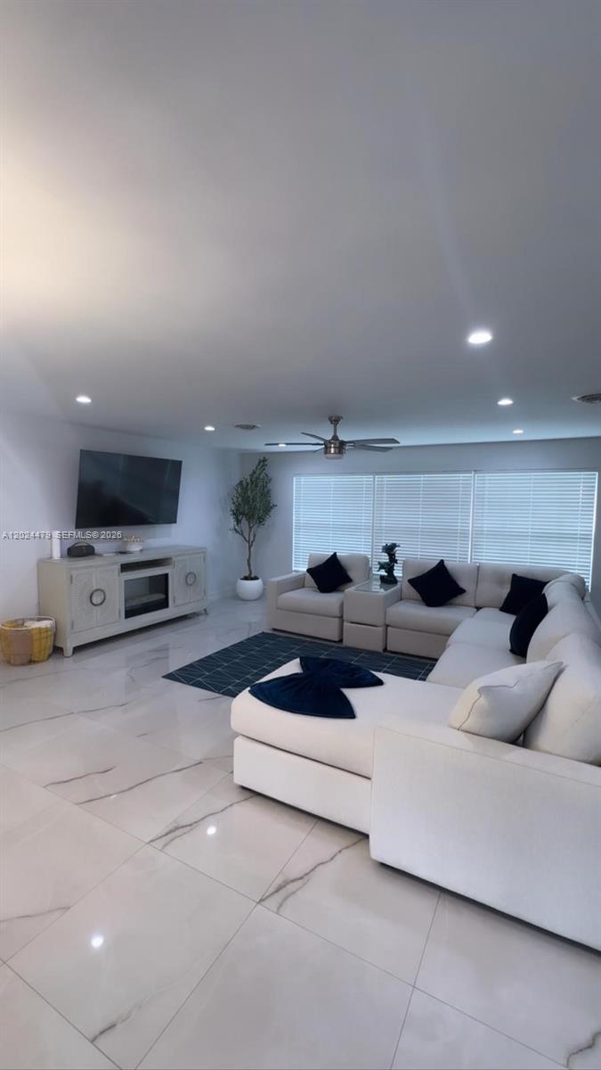 2212 Club House Road North Fort Myers, FL 33917 - Photo 9 of 40 a living room with furniture and a flat screen tv
