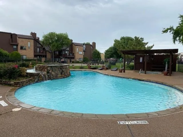 a swimming pool with outdoor seating and yard