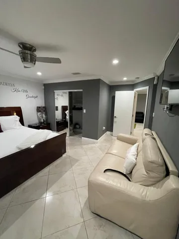 a large bedroom with a large bed and furniture