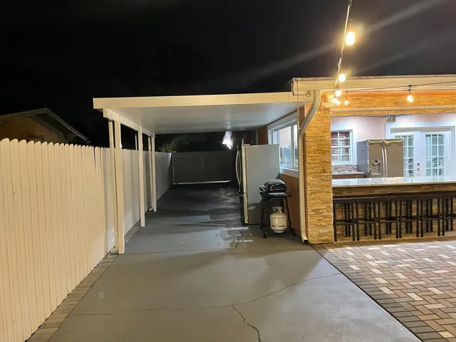 a view of a livingroom with a kitchen