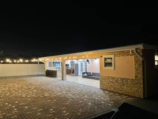 a view of a balcony with two chairs and a table