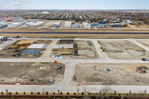 an aerial view of a building with beach