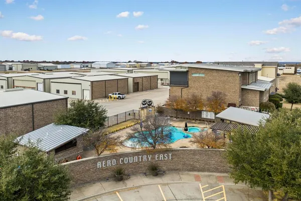 a view of a terrace with chairs and potted plants
