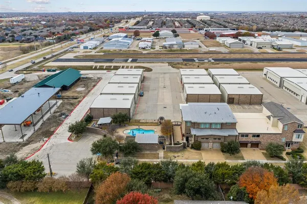 an aerial view of residential houses with outdoor space
