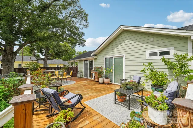 a view of a patio with table and chairs and potted plants