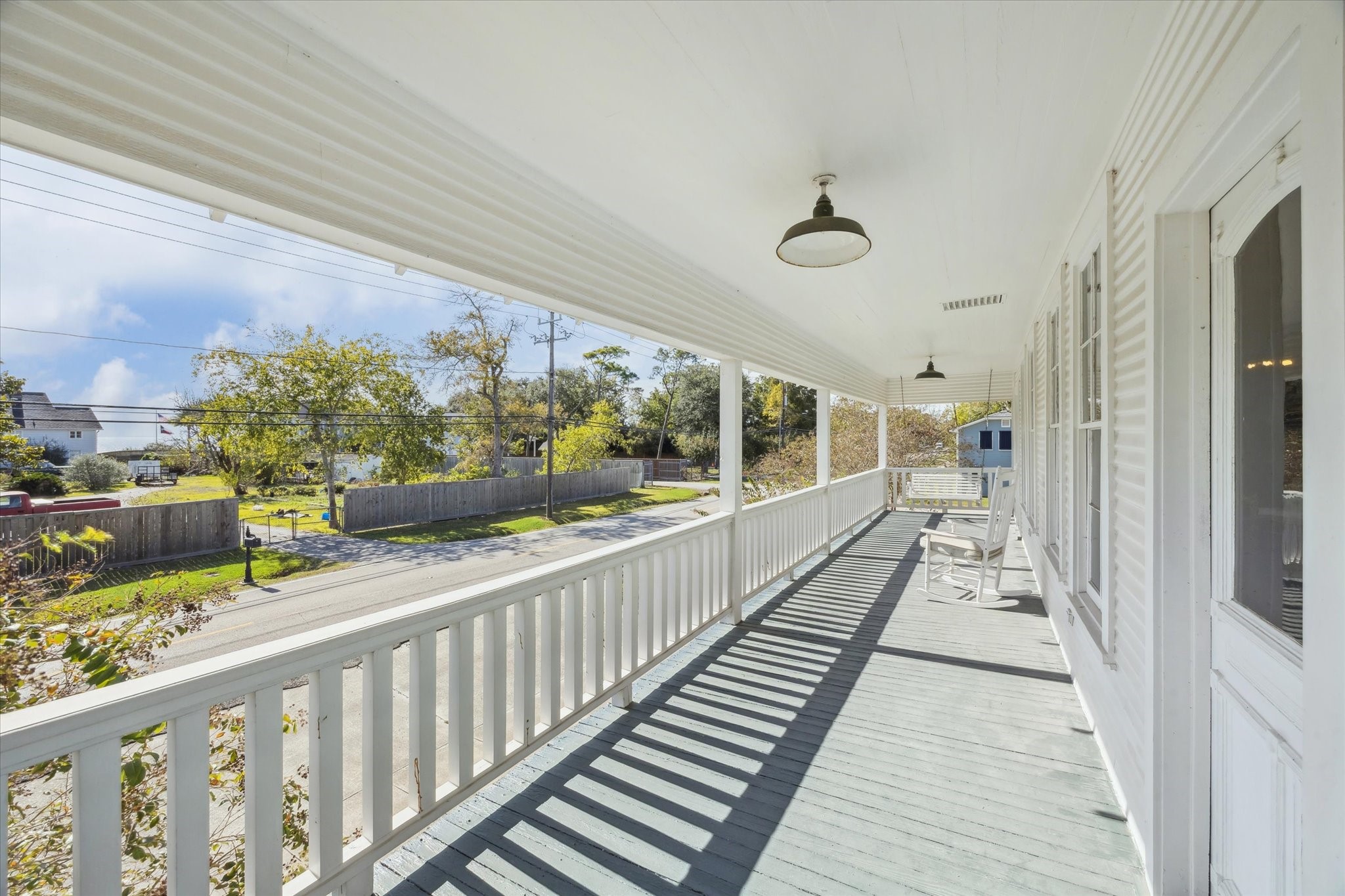 618 Bayridge Road La Porte, TX 77571 - Photo 12 of 40 THE BAY-VIEW BALCONY SPANS THE ENTIRE WIDTH OF THE HOME AND OFFERS A RELAXING SPOT TO SPEND MORNINGS AND AFTERNOONS.