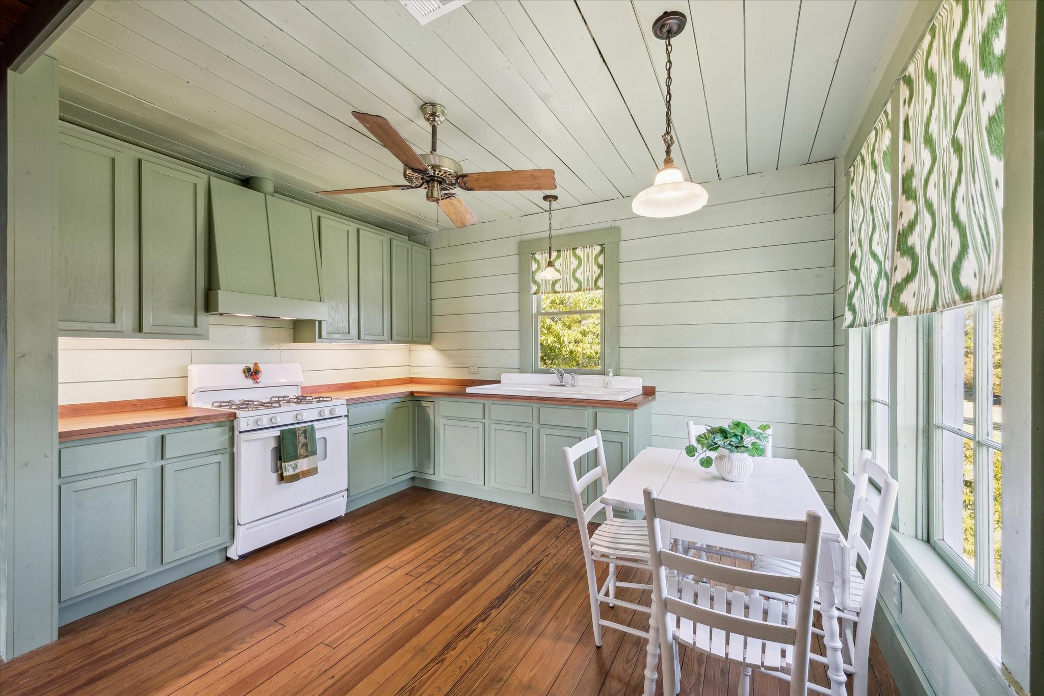 618 Bayridge Road La Porte, TX 77571 - Photo 17 of 40 THE KITCHEN FEATURES CHOPPING BLOCK COUNTERS, A FARMHOUSE SINK AND UNDER CABINET LIGHTING.