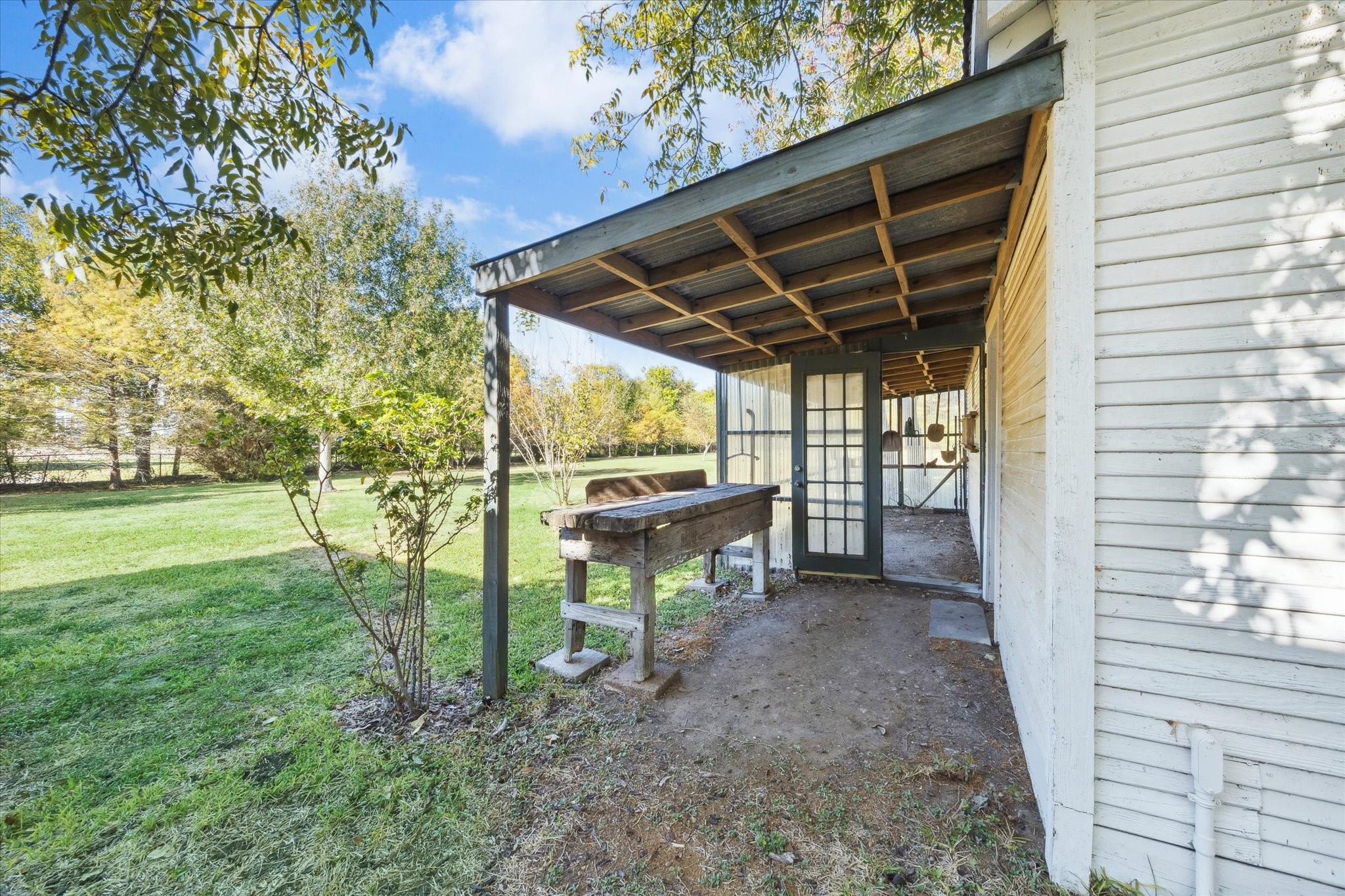 618 Bayridge Road La Porte, TX 77571 - Photo 28 of 40 ENTRANCE TO THE BARN AND A SEPARATE GREENHOUSE.