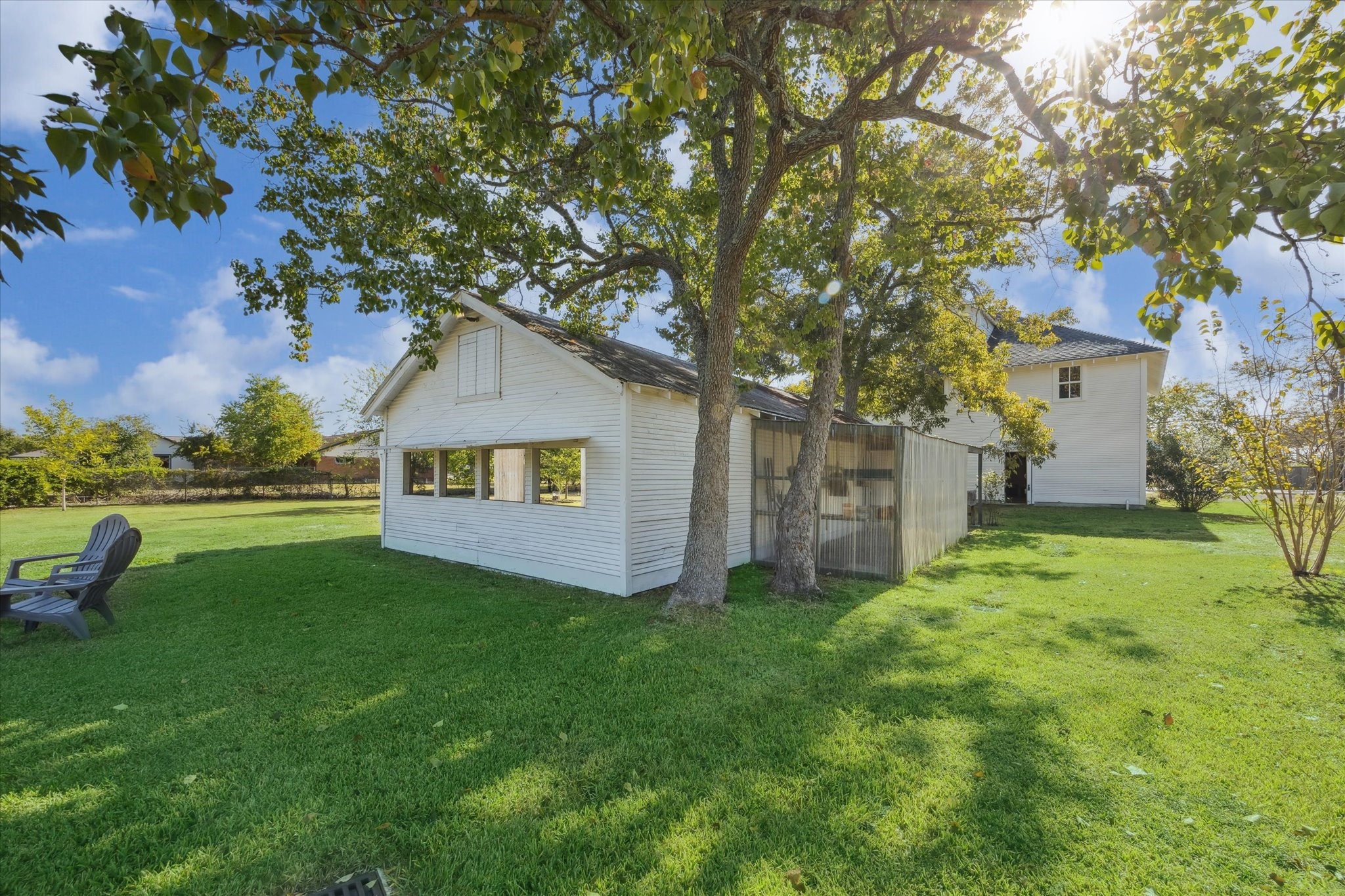 618 Bayridge Road La Porte, TX 77571 - Photo 31 of 40 VIEW OF THE BACK OF THE BARN WITH THE SHUTTERS RAISED.