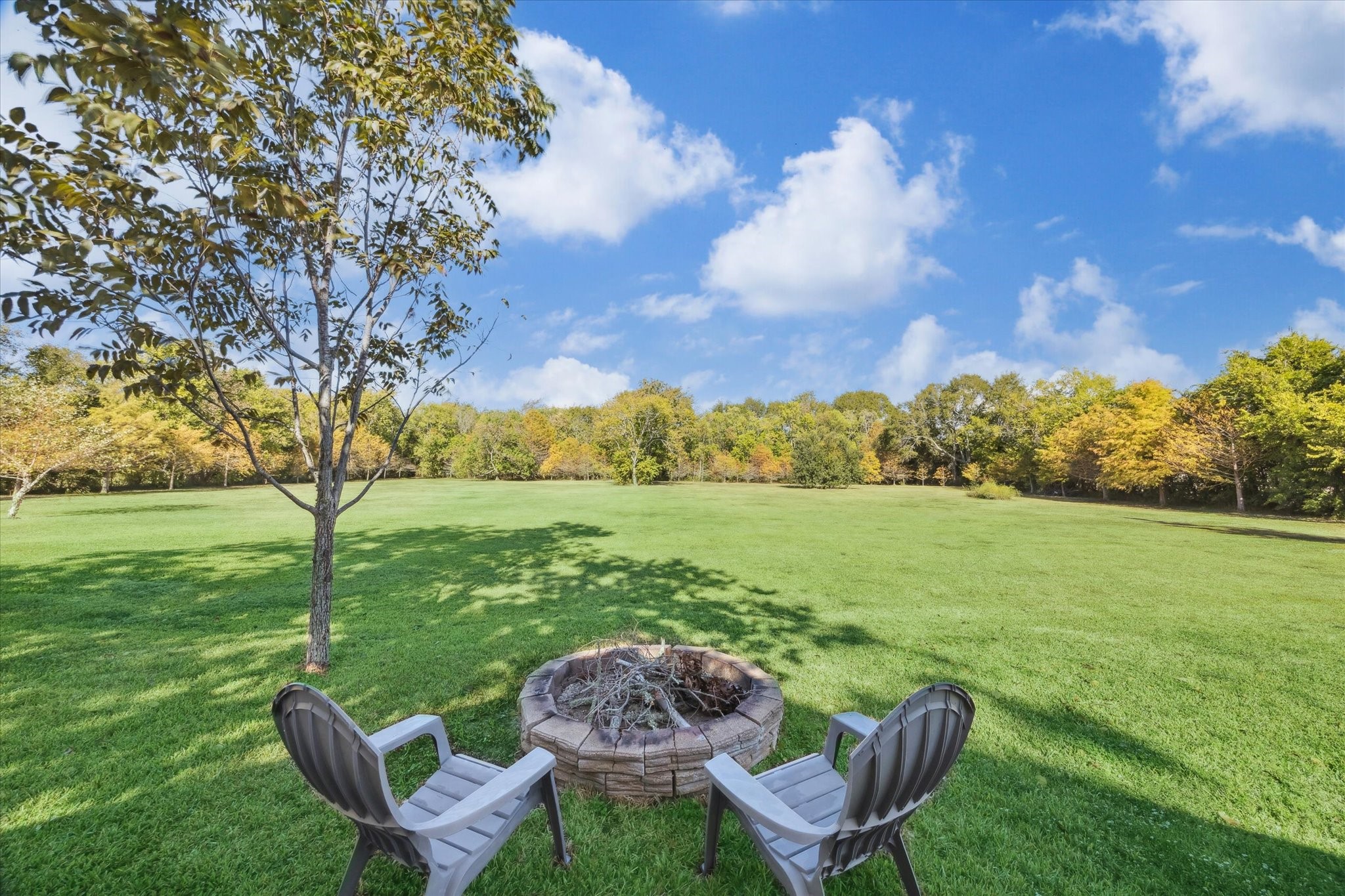 618 Bayridge Road La Porte, TX 77571 - Photo 7 of 40 RELAX AT THE FIREPIT BEHIND THE BARN OVERLOOKING THE 1.7 ACRES SURROUNDED BY TREES.