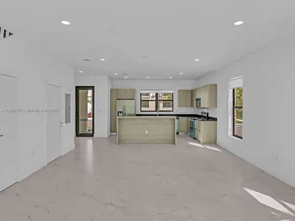 a view of an empty room with a window