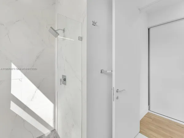 a sign that is in front of flowers