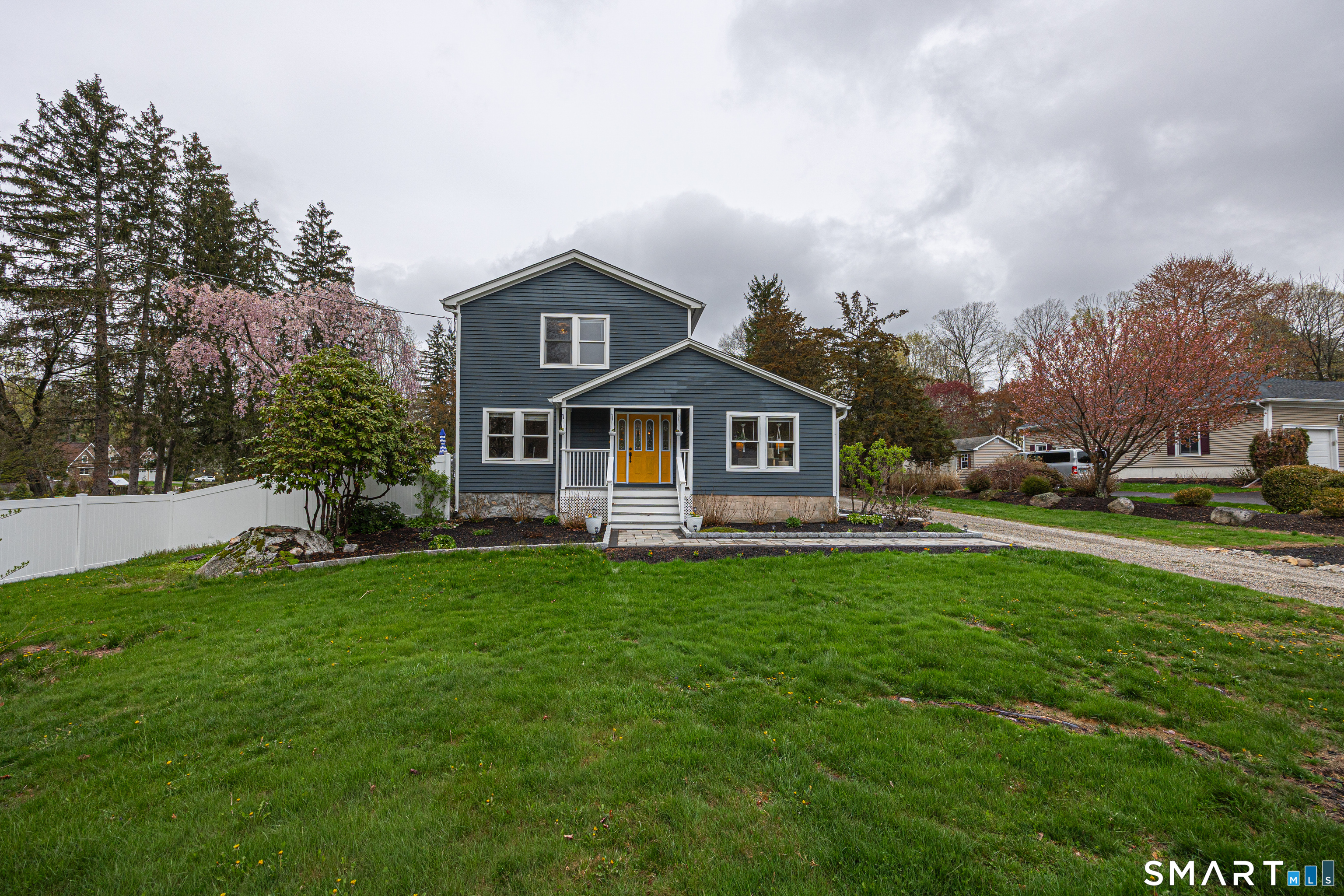 a front view of a house with garden