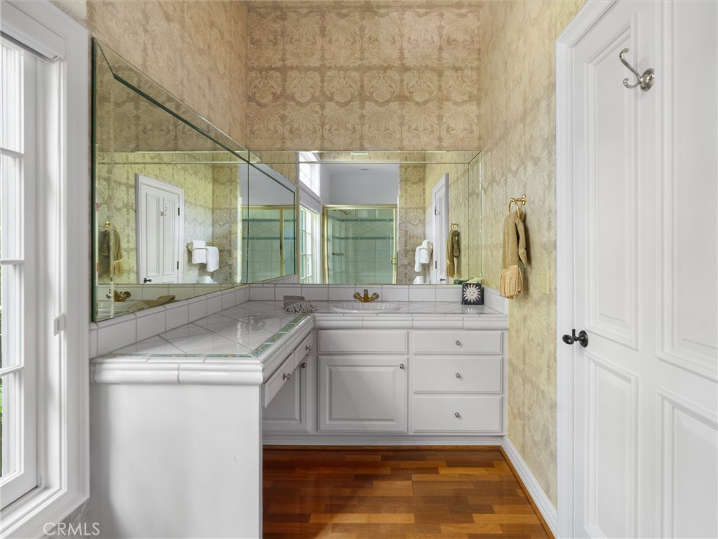 6000 Cavalleri Road Malibu, CA 90265 - Photo 42 of 44 a bathroom with a sink and a mirror