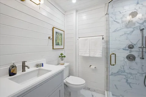 a picture of a bathroom with a shower